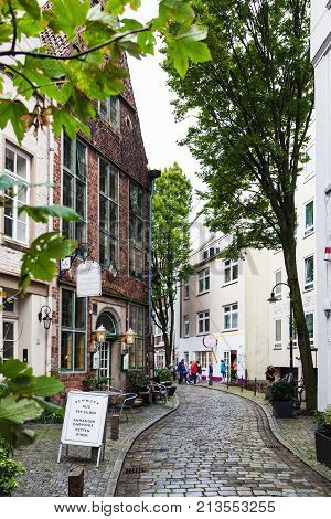 People On Alley In Schnoor Quarter In Rainy Day