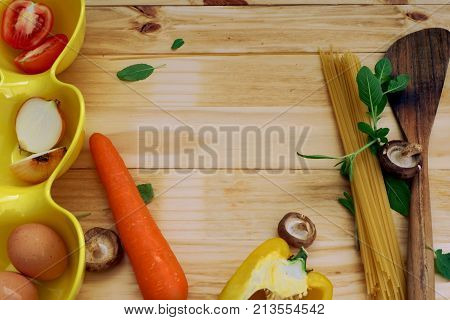 Food ingredients for cooking pasta on wood board,top view for copy space