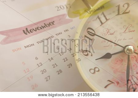 Time and planning concept, collage with vintage clock and calendar page in November,2017