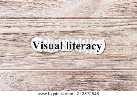 visual literacy of the word on paper. concept. Words of Avisual literacy on a wooden background.