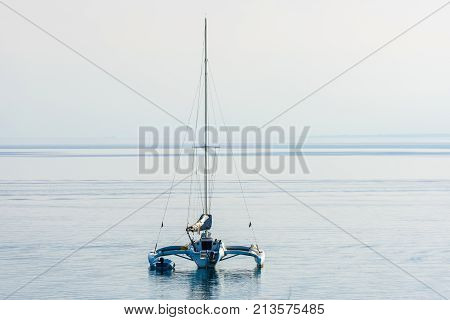 Catamaran Is Moored In Calm Sea Of Adriatic Sea.