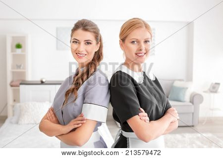 Beautiful chambermaids in room