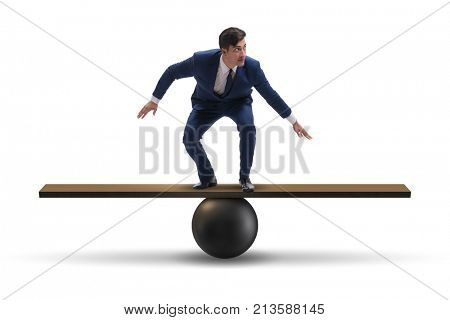 Businessman balancing on seesaw in uncertainty concept