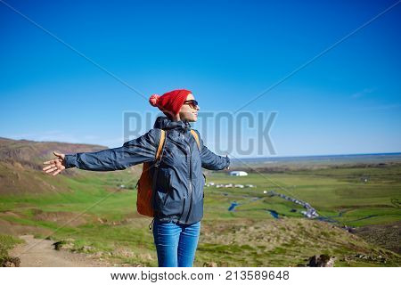 woman traveler on a walk in the Valley of the river of Hveragerdi Iceland. Hiking Tour of Reykjadalur Hot Springs