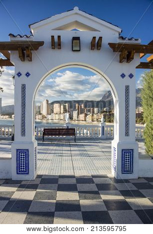 View of the coastline of Benidorm through an arch on the Plaza Old Town Benidorm Alicante Spain