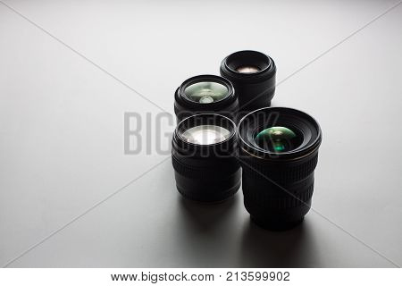 Close-up View Of A Group Of Camera Lenses On A White Surface