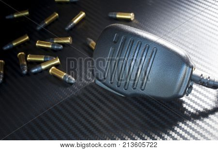 Police radio microphone with a lots of rim fire ammo