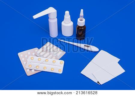 Medications, Pills And A Thermometer On A Bright Background