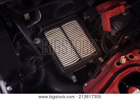 Air filter change maintenance Dirty air filter makes the air flowing through the intake manifold in the engine car less. Automotive parts concept.