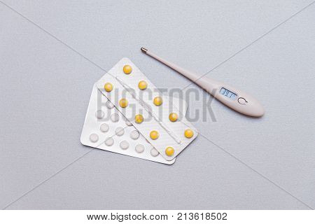 Medications And A Thermometer On A Light Background