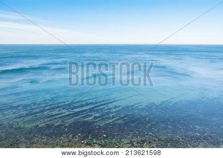 Horizon line - between sky and water on the bleack sea.