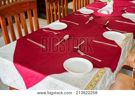 Big table at retaurant served for upcoming banquet