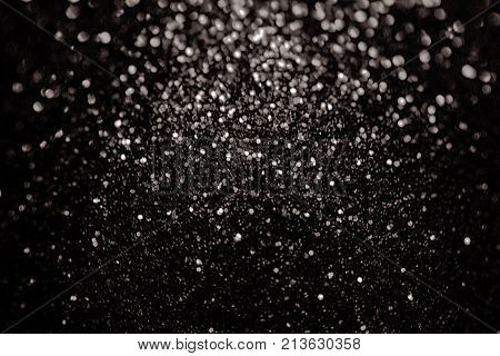 Black silver glitter sparkle background. Black friday shiny pattern with sequins. Christmas glamour luxury pattern, black christmas and glitter diamond background. Dark silver black friday pattern