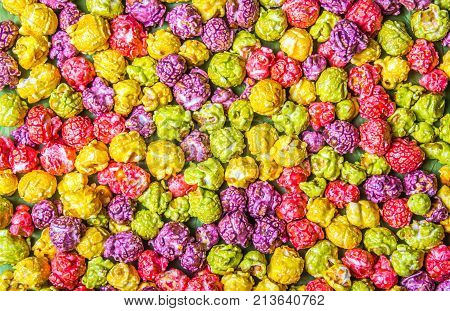 Bright caramel popcorn. Multicolored popcorn. Backgrounds and textures.