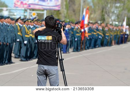 TV Karaganda chanel operator.Kazakhstan army parade.V-day celebration.Sary Shagan.Former Soviet anti-ballistic missile testing range.West Bank of Balkhash lake .May 9, 2017.Priozersk.Kazakhstan

