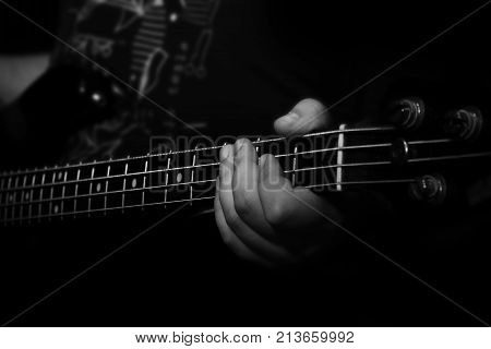 Bass Guitar Player Playing Bass In Music Studio