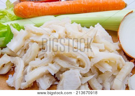 trippa with vegetable ingredients on wood table