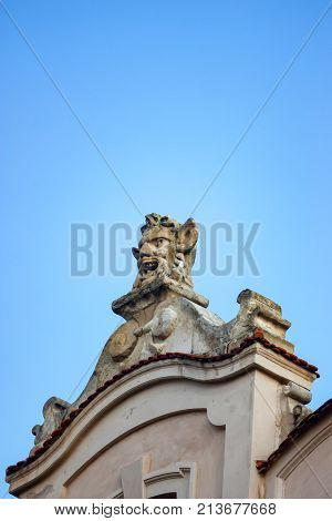 KRAKOW, POLAND - JUNE, 2012: Mascaron on column of Krakow Cloth hall