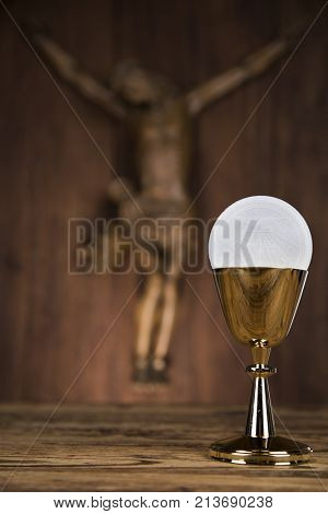 Eucharist symbol of bread and wine, chalice and host, First communion background
