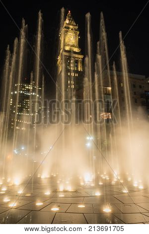 Fountain Blasts Upward as Custom House Tower Looms Behind