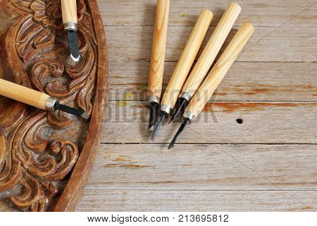 Carving instrument of carpenters for made wood craft on old wooden table