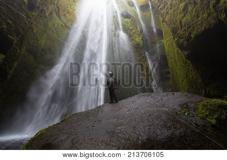 Hidden waterfall in Iceland Gljufrafoss with a adventure woman