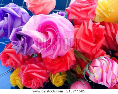 Rose fake flower and Floral backgroundrose flowers made of fabric. The fabric flowers bouquet. Colorful of decoration artificial flower.