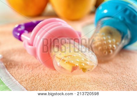 Baby's nibblers and bib on table