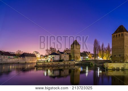 medieval bridge Ponts Couverts and barrage Vauban, night scene of Strasbourg, France