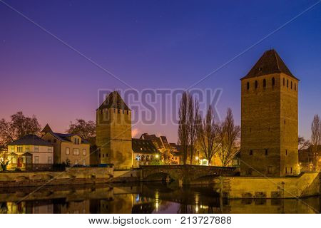 medieval bridge Ponts Couverts and barrage Vauban, night scene of Strasbourg, France