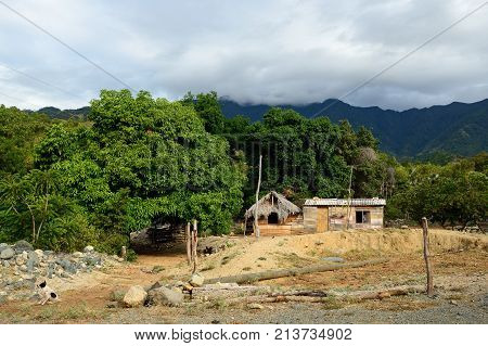 Wooden house in one of villages by the trail for the highest peak on Cuba Pico Turquino being in a mountain range Sierra Maestra on Cuba