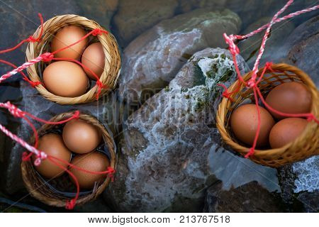 Three baskets of eggs boiled in hot springs Chiang Mai, Thailand. Unusual asian food