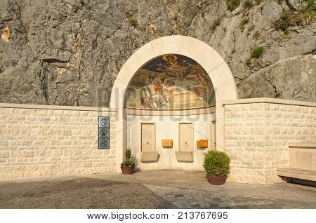 MONTENEGRO, DANILOVGRAD - AUGUST 10, 2017: Holy spring at the entrance to Ostrog Male Orthodox Monastery
