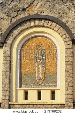 MONTENEGRO, DANILOVGRAD - AUGUST 10, 2017: Mosaic icon on the facade of male Ostrog monastery landmark