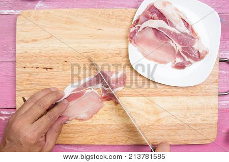 Chef sicing pork for cooking / Cooking Yakisoba concept