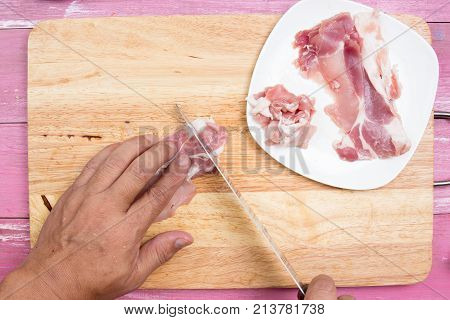 Chef sicing pork for cooking / Cooking Yakisoba concept