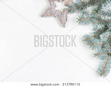 Christmas frame with Fir tree branches on white. Card Merry Christmas and Happy New Year with copy space.