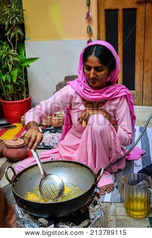 Indian Women Cooking Traditional Food