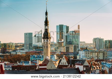 Tallinn, Estonia. Tower Of Tallinn Town Hall On Background Of Modern Architecture. Oldest Town Hall In Baltic Region And Scandinavia.