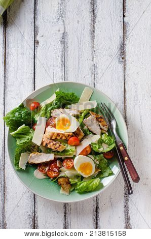 Grilled chicken salad with tomatoes and parmesan cheese