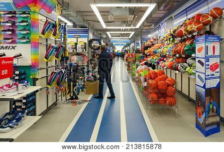 MOGILEV BELARUS - SEPTEMBER 28 2016: Unidentified people choose items for outdoor activities in sporting goods store 