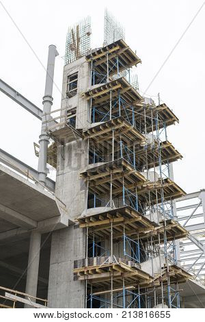 Construction of a concrete house. retaining scaffolding