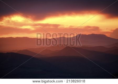 red sunset on layered hills of Simeto Valley, Sicily 