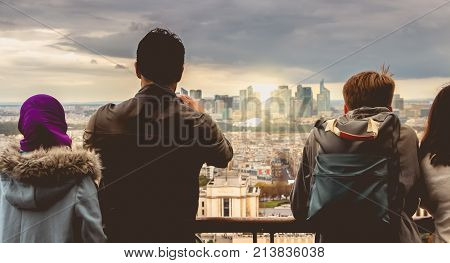 Tourists Take Pictures Of La Défense Business District At Sunset