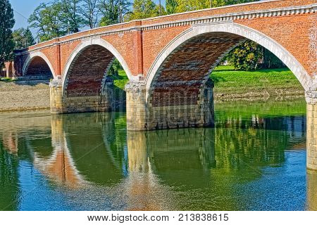 Old bridge on river Kupa on a beautiful sunny day in Sisak Croatia.