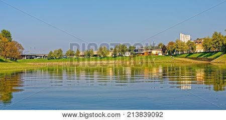 SISAK, CROATIA - September 30, 2017: Reflection on the surface of the Kupa river on a beautiful sunny day in Sisak Croatia.