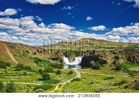 famous Hjalparfoss waterfall in southern Iceland. treking in Iceland. Travel and landscape photography concept