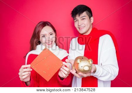 couple show couplet and piggy on the red background