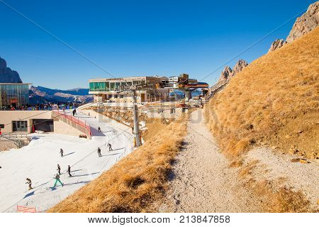 December 2015 Siusi Alp in Italy This is the arrival of the Siusi Alp Gondola in the north of Italy that takes tourists to this artificially snowy trail because it has not yet snowed.