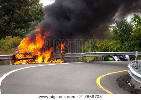 Car On Fire With Passengers
